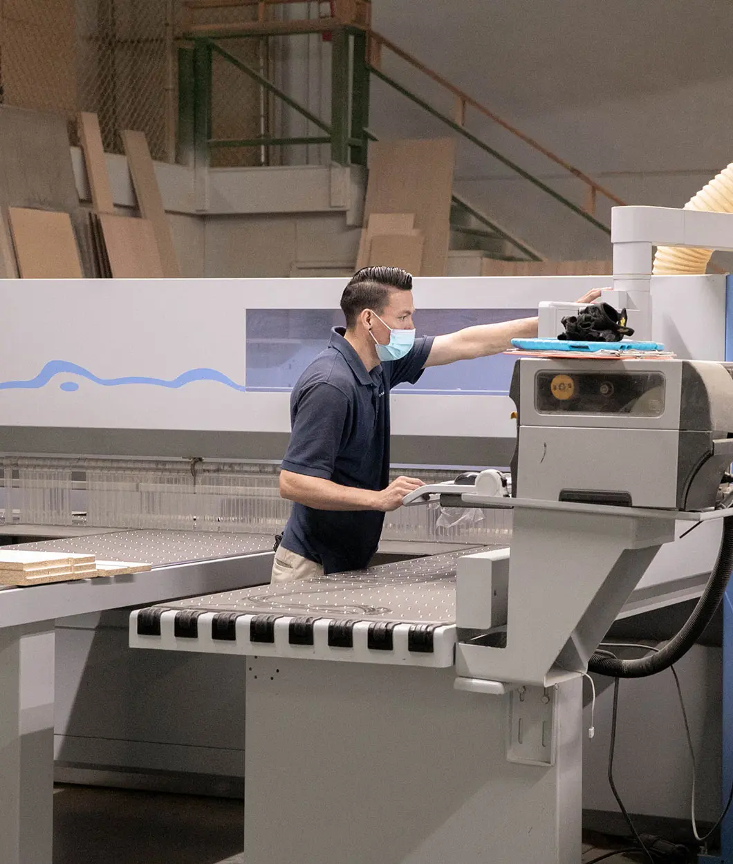 man working in factory on wall bedd