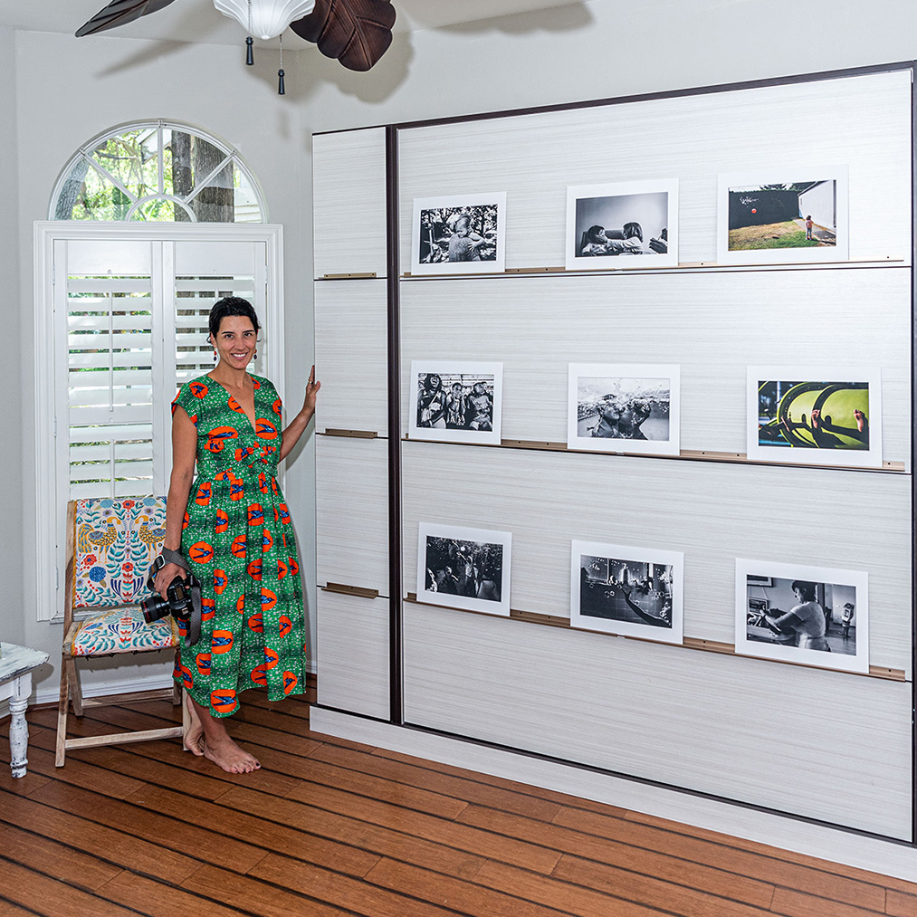 photographer shows off her closed murphy bed