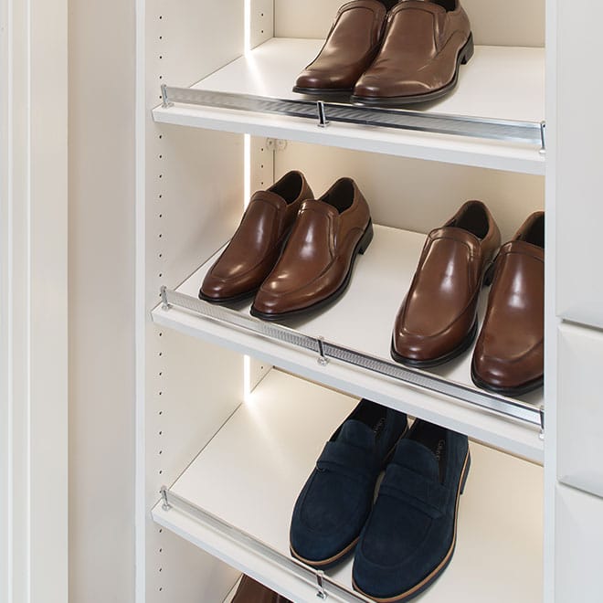 slanted shoe shelves with fence